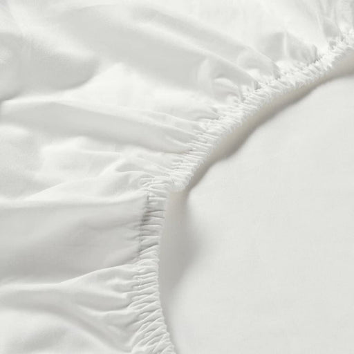 A close-up of an IKEA fitted sheet's elastic edges shows its stretchiness and durability  60342722