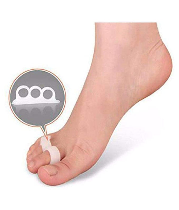 Pain-free walking achieved through the use of a 3-hole toe separator foot care tool for foot pain relief and realigned toes.
