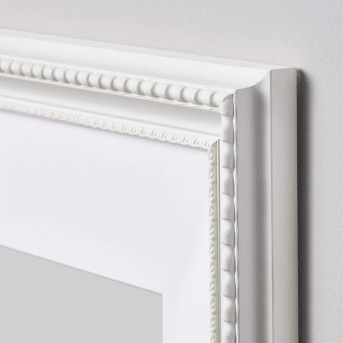 A classic white photo frame that brings a touch of elegance to any room 00466838