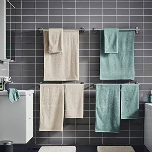 Agrey-turquoise hand towel from the Ikea 6 Piece Combo Set, hanging on a silver towel bar next to a white sink.