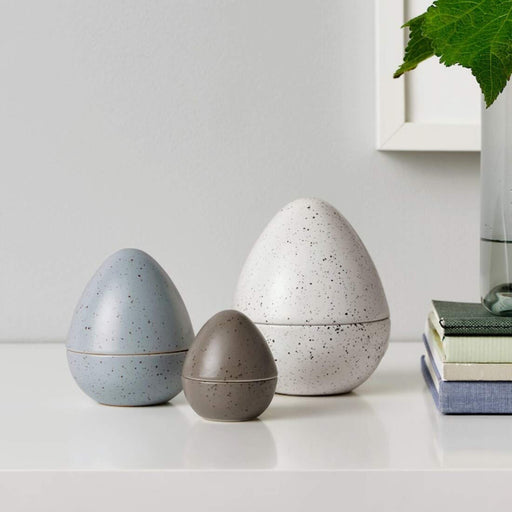 Egg-shaped decorative accessory in a modern living room, adding a touch of elegance and simplicity to the space 40466308