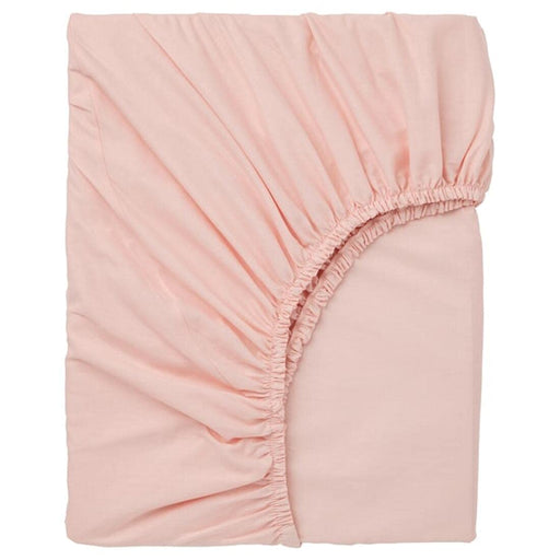 A light pink fitted sheet with elastic edges, made of soft and durable material, perfect for a comfortable night's sleep-10357669