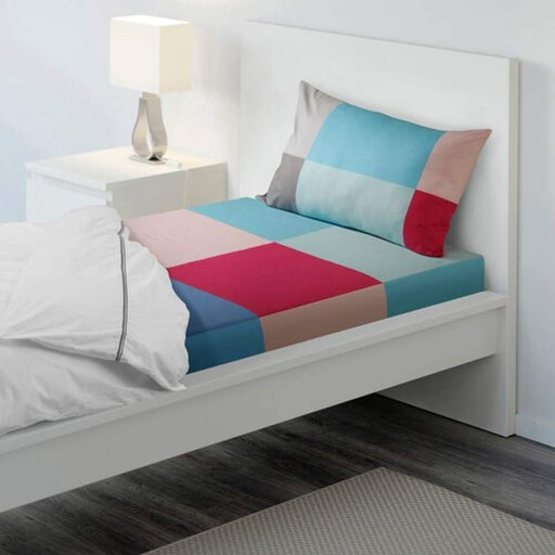Multicolor cotton flat sheet and pillowcase set from IKEA on a bed  90427593