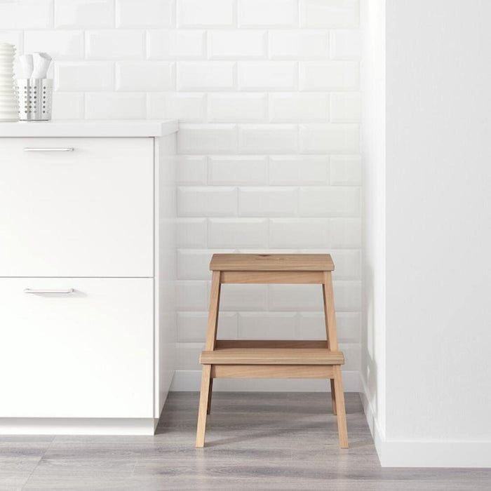  IKEA step stool in a bathroom, showing its space-saving design and multi-functional use.