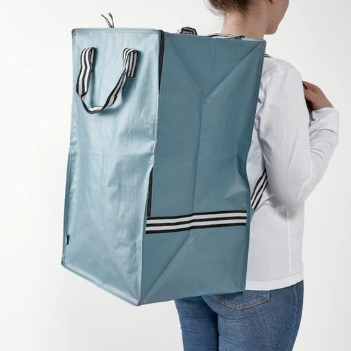  Person carrying IKEA GÖRSNYGG blue bag using shoulder straps both hands free