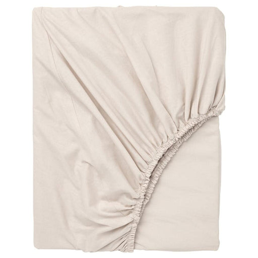 An IKEA fitted sheet in a soft, beige color