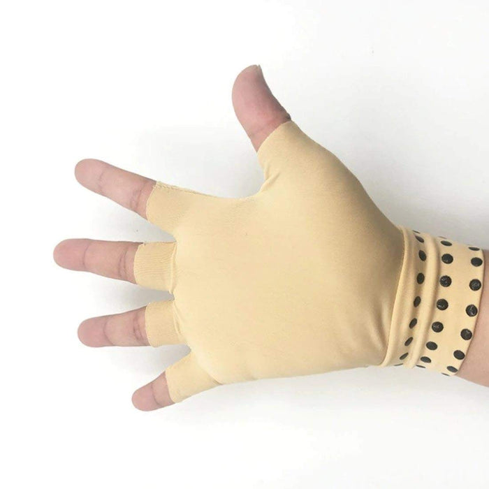 A person wearing Magnetic Therapy Fingerless Massage Gloves while typing, showcasing their fingerless design for maximum flexibility and dexterity.