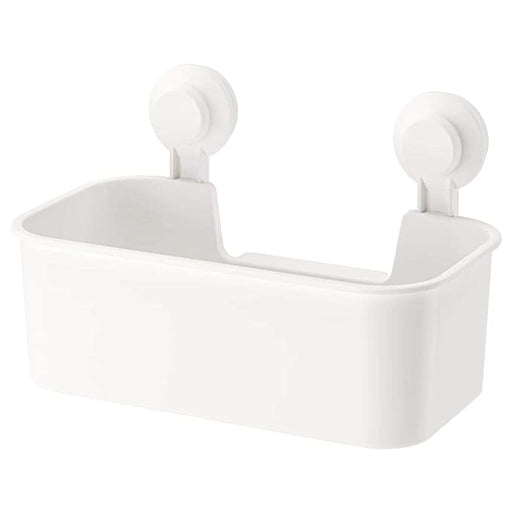 A white IKEA Basket with a suction cup attached to its back, hanging on a tiled bathroom wall with various toiletries inside.