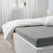 A fitted sheet with a smooth and wrinkle-free finish that gives a neat and tidy look to the bed 00482447