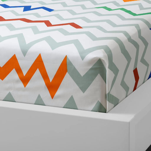 Multicolor cotton flat sheet and pillowcase from IKEA draped on a bed   70454785