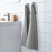 An image of an IKEA hand towel in a natural and grey striped pattern, adding a classic and timeless touch to any bathroom 60219821 