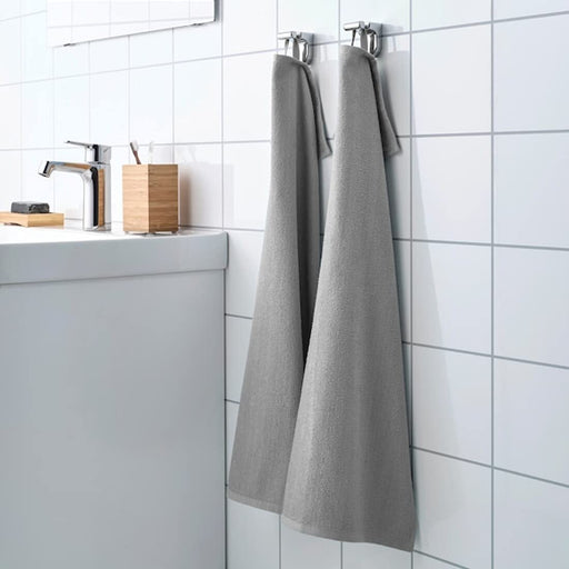 An image of an IKEA hand towel in a grey striped pattern, adding a classic and timeless touch to any bathroom 80451116