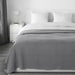  a soft, woven fabric finish from IKEA, covering a bed with a size of 160x250 cm."30389075,70389078