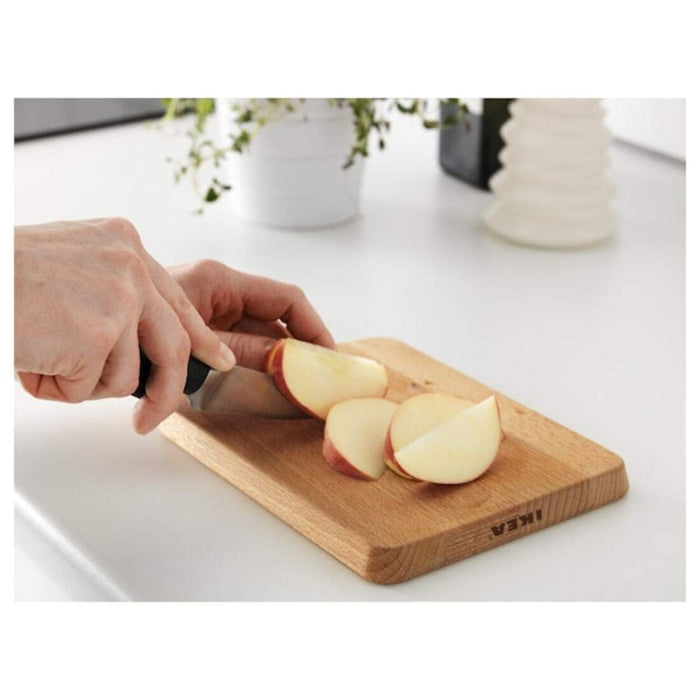 An eco-friendly and sustainable bamboo chopping board from IKEA, featuring a stylish design.