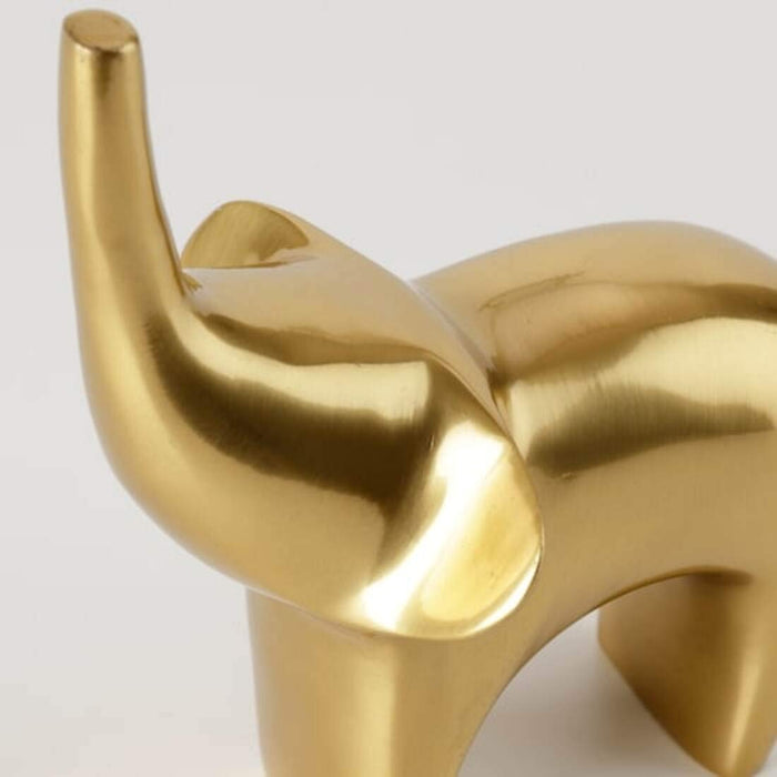 A close-up of the cute elephant design on IKEA's Gold-Colour Elephant Decoration 50497314