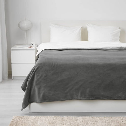 A versatile grey bedspread from IKEA, measuring 150x250 cm, with a lightweight and breathable fabric that is perfect for any season 70384052