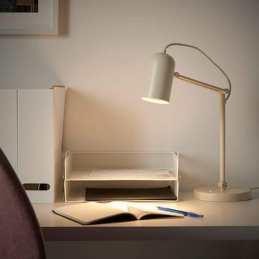 "IKEA work lamp with adjustable arm and base for task lighting"