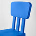 "A blue IKEA children's chair on a sandy beach