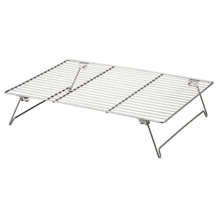 A durable cooling rack made of heavy-duty steel wire with a rust-resistant finish, featuring a flat surface and four stable feet.