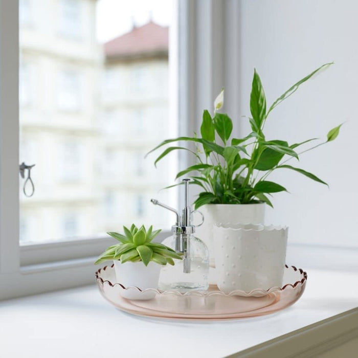 IKEA's Light Pink Decoration Dish used as a catch-all for small accessories, keeping them organized and easily accessible 20478369