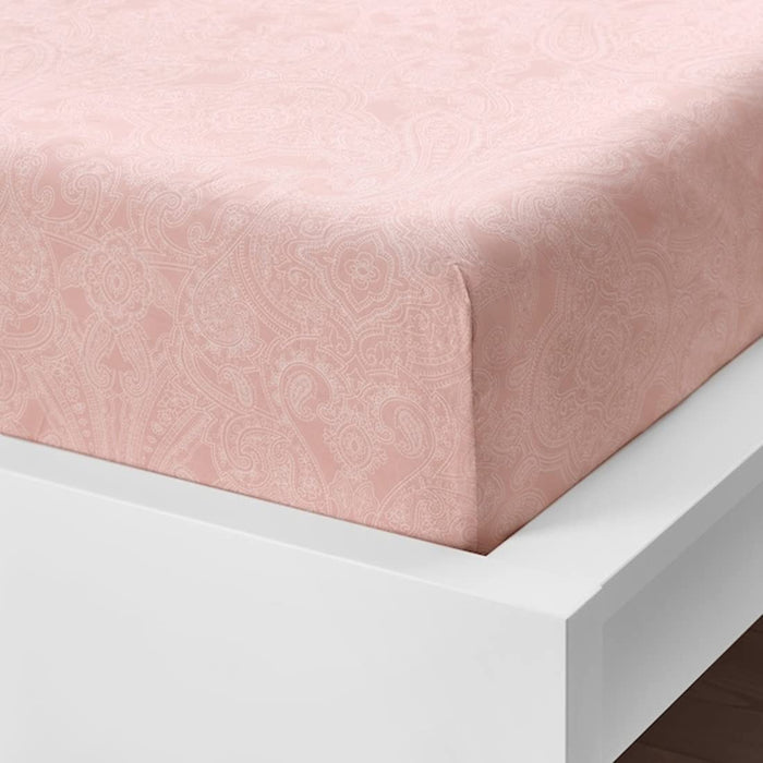 A closeup image of IKEA fitted sheet on a bed with neatly tucked corners and a smooth surface 20501614