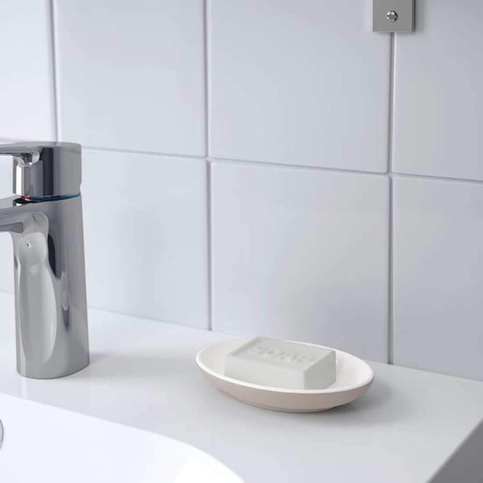 A sturdy soap holder in a neutral color, crafted from durable stoneware and ideal for everyday use. 00493002