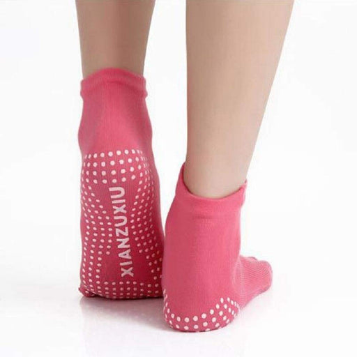 A pair of professional non-slip breathable yoga socks with five toe design.