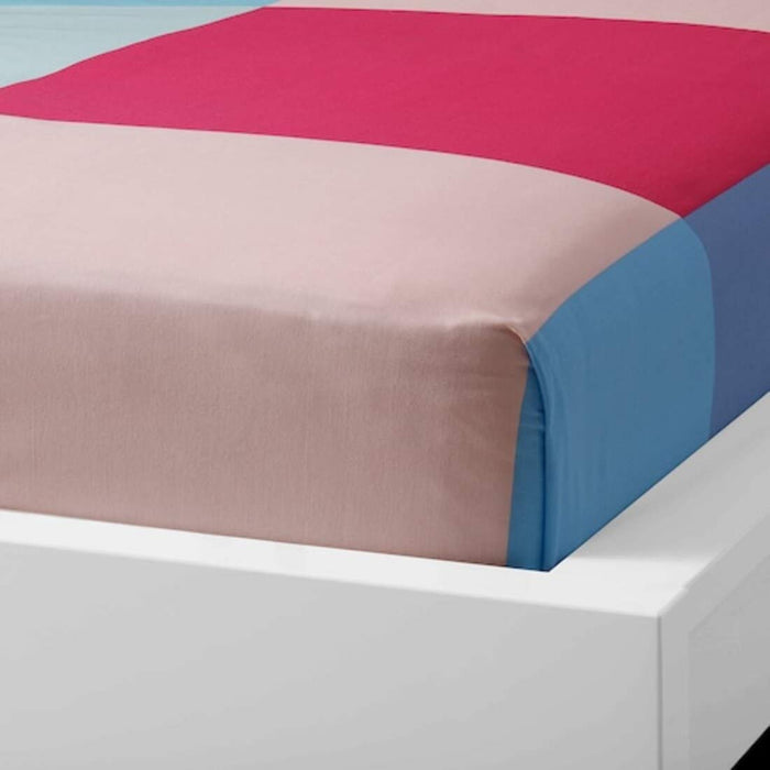 cotton flat sheet and pillowcase set from IKEA draped on a bed 9042759