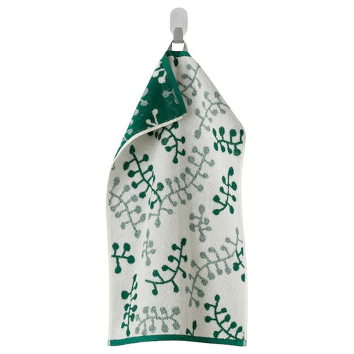A Green/White hand towel with a soft, smooth texture 20494388