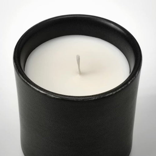 A decorative and aromatic candle in pot from IKEA, featuring a charming design and delightful fragrance that will fill your home with joy.