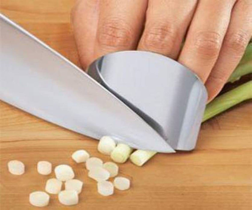 Picture of a finger guard tool in use, demonstrating how it protects fingers while slicing and dicing vegetables for cooking