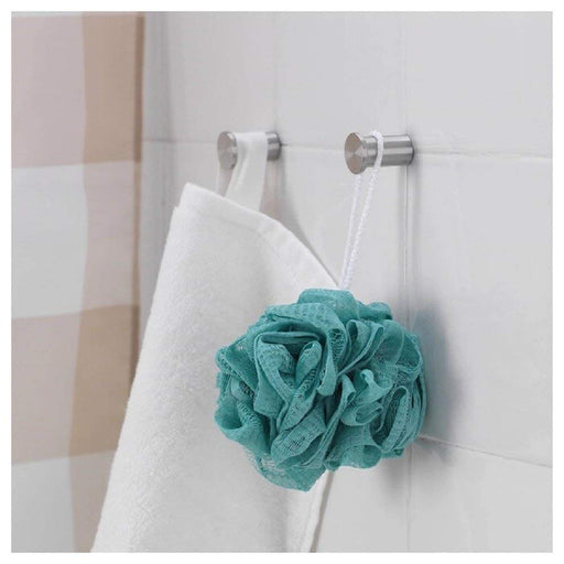 Colorful body puffs hanging in a bathroom 20285139