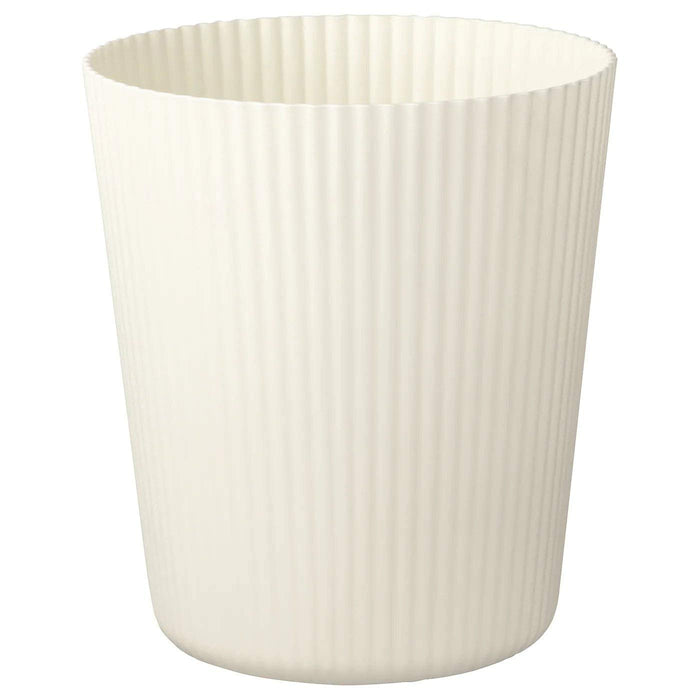 A round, beige plant pot with a matte finish and a narrow opening. 20294959