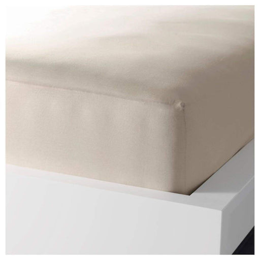 A closeup image of IKEA fitted sheet on a bed with neatly tucked corners and a smooth surface -60356568