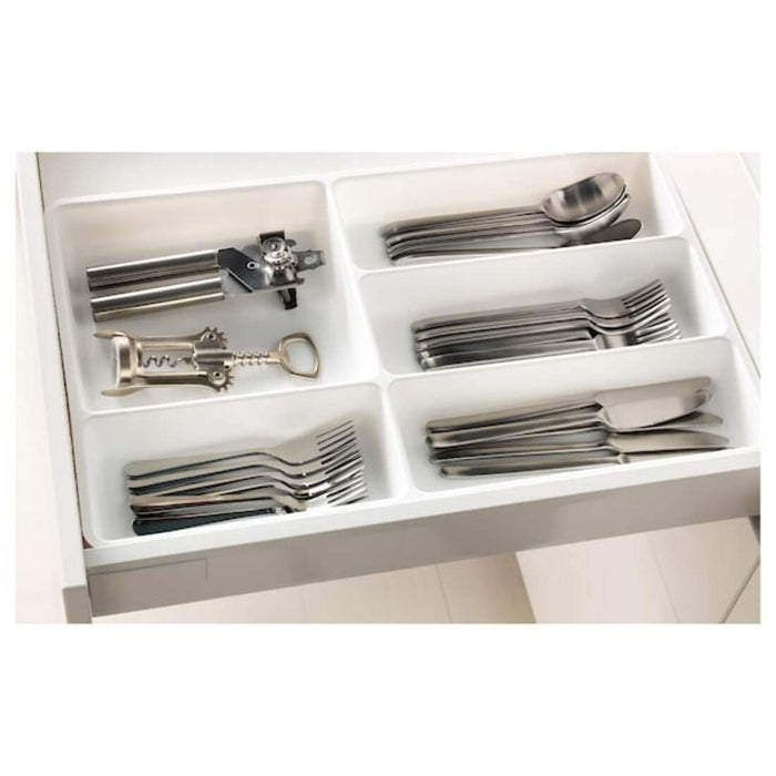 A white ceramic IKEA cutlery tray with a classic look and multiple compartments for organizing cutlery.