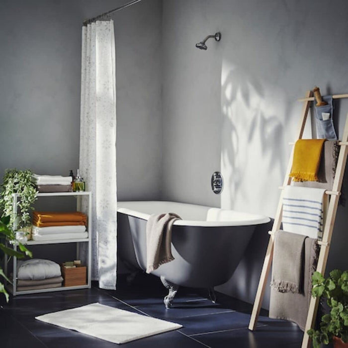 A bath towel hanging on a hook on the back of a bathroom door 40502231