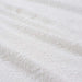A close-up of an IKEA bath towel, 70x140 cm, showing the texture of the fabric and the embroidered IKEA 30447358