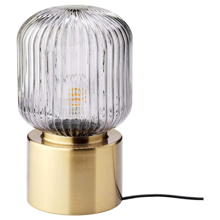 Elegant IKEA table lamp with a brass finish, adding a touch of sophistication to a living room or bedroom70464280