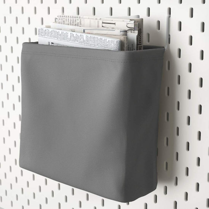 A fabric storage bag with a metal hanger for attachment to a pegboard.  90320813