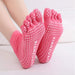 A pair of professional non-slip breathable yoga socks with five toe design.