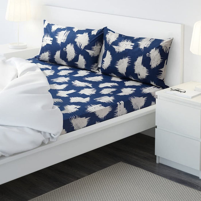 Blue cotton flat sheet and 2 pillowcase set from IKEA on a bed 90444309