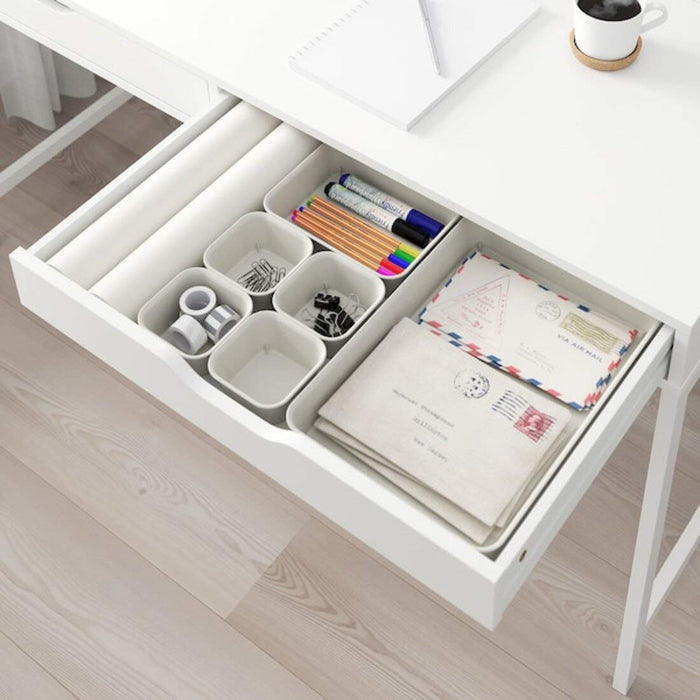 An IKEA drawer organizer made of sustainable bamboo, with adjustable dividers to keep cutlery, utensils, or other small items organized.