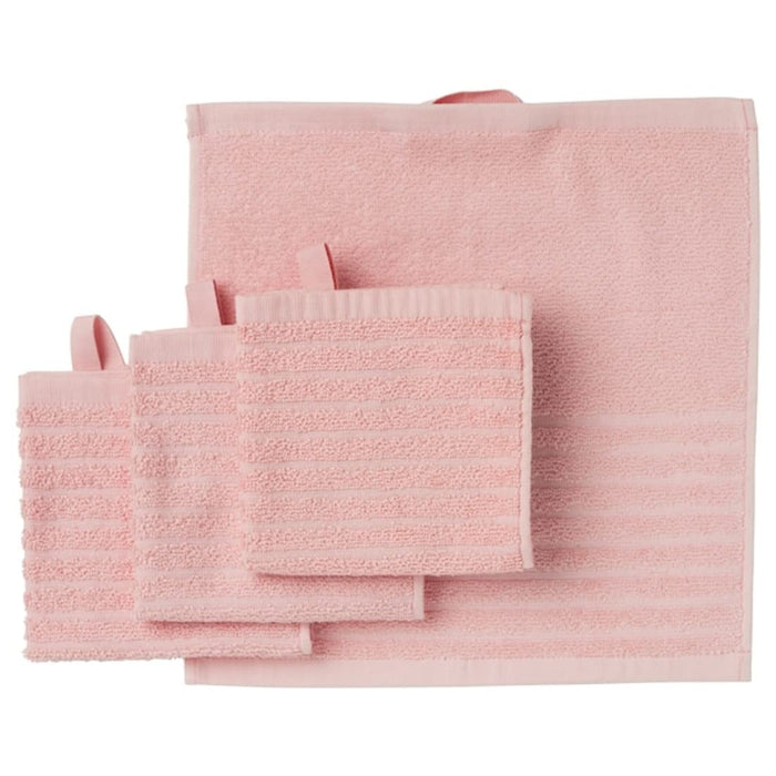 A pink wash cloth from the Ikea 6 Piece Combo Set, draped over a white bathtub.