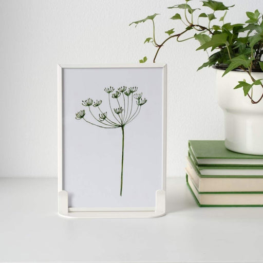 A modern grey photo frame with a minimalist design, ideal for showcasing your art or photography  90459094