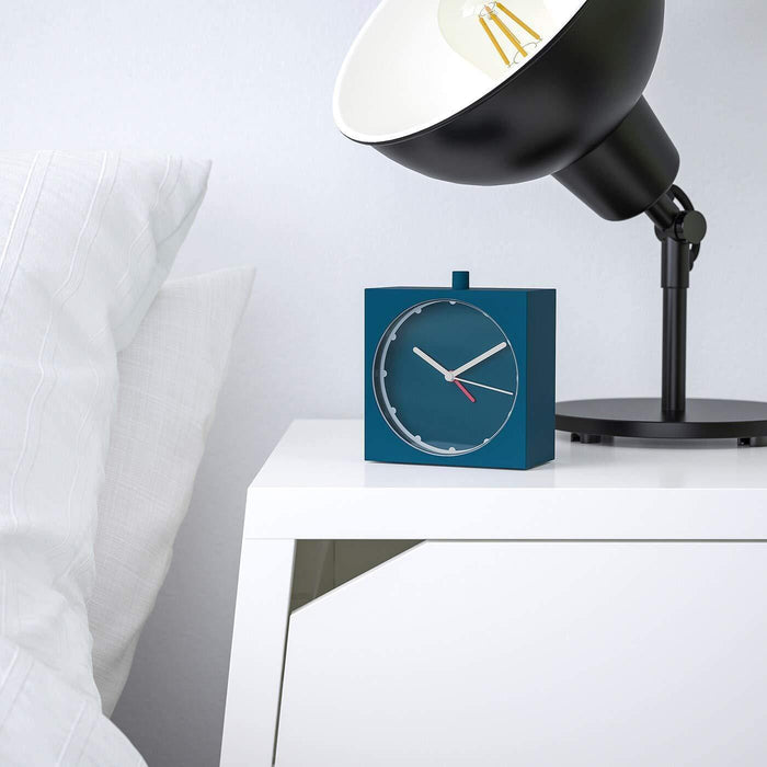 A sleek and modern alarm clock with a simple design