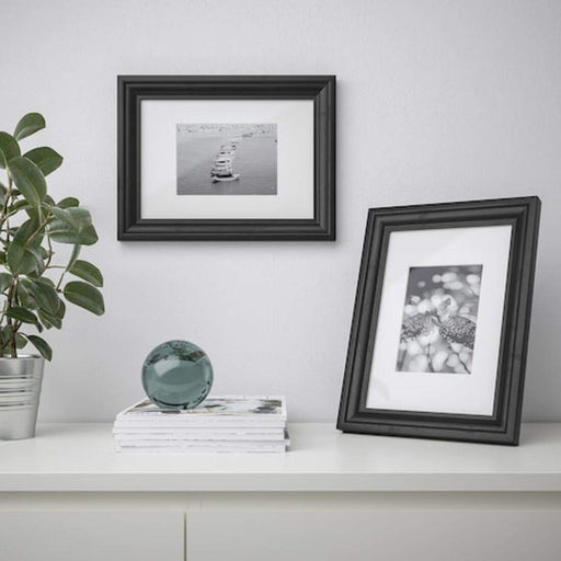 A collage photo frame that allows you to display multiple photos at once, creating a unique and personalized display  60427622