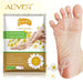 A close-up of the ALIVER Camomile Feet Exfoliating Foot Mask peeling dead skin off a woman's feet.