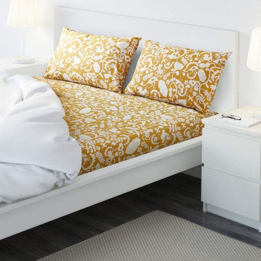 Yellow cotton flat sheet and 2 pillowcase set from IKEA on a bed  80418952