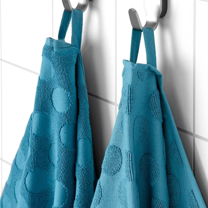 Textured blue bath towel with dimensions 70x140 cm (28x55 inches), perfect for after a shower or bath.90492041