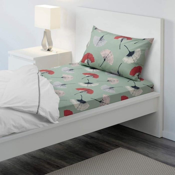 Turquoise Cotton flat sheet and pillowcase from IKEA on a bed  00493813
